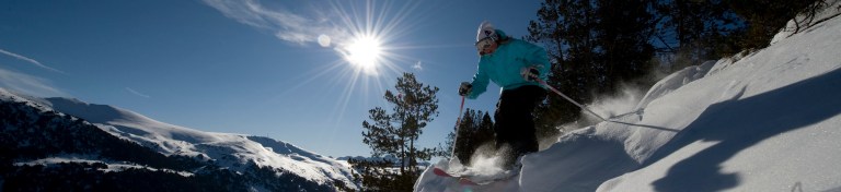 Bridget Little skiing off-piste in beautiful weather in Preparation for delivering some training on a GAP-YEAR Ski instructors course in Soldeu, Andorra for Pro Ski Training 
